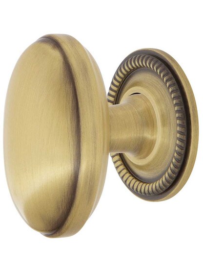 Homestead Cabinet Knob - 1 1/8 inch x 1 3/4 inch with Rope Rosette in Antique Brass.
